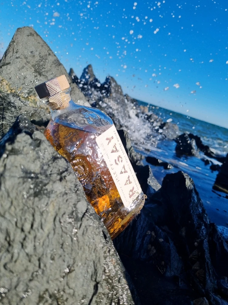 Whiskey and a crashing wave