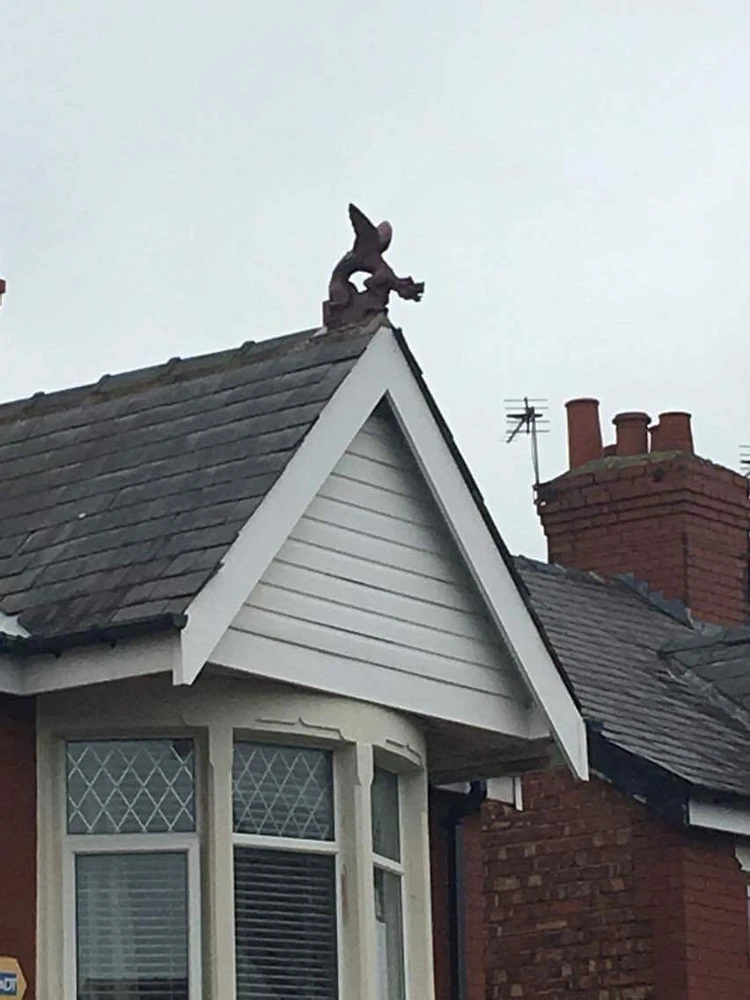 Someone wanted a gargoyle on the apex of the roof the front ridge, Custer gets what’s he wants 