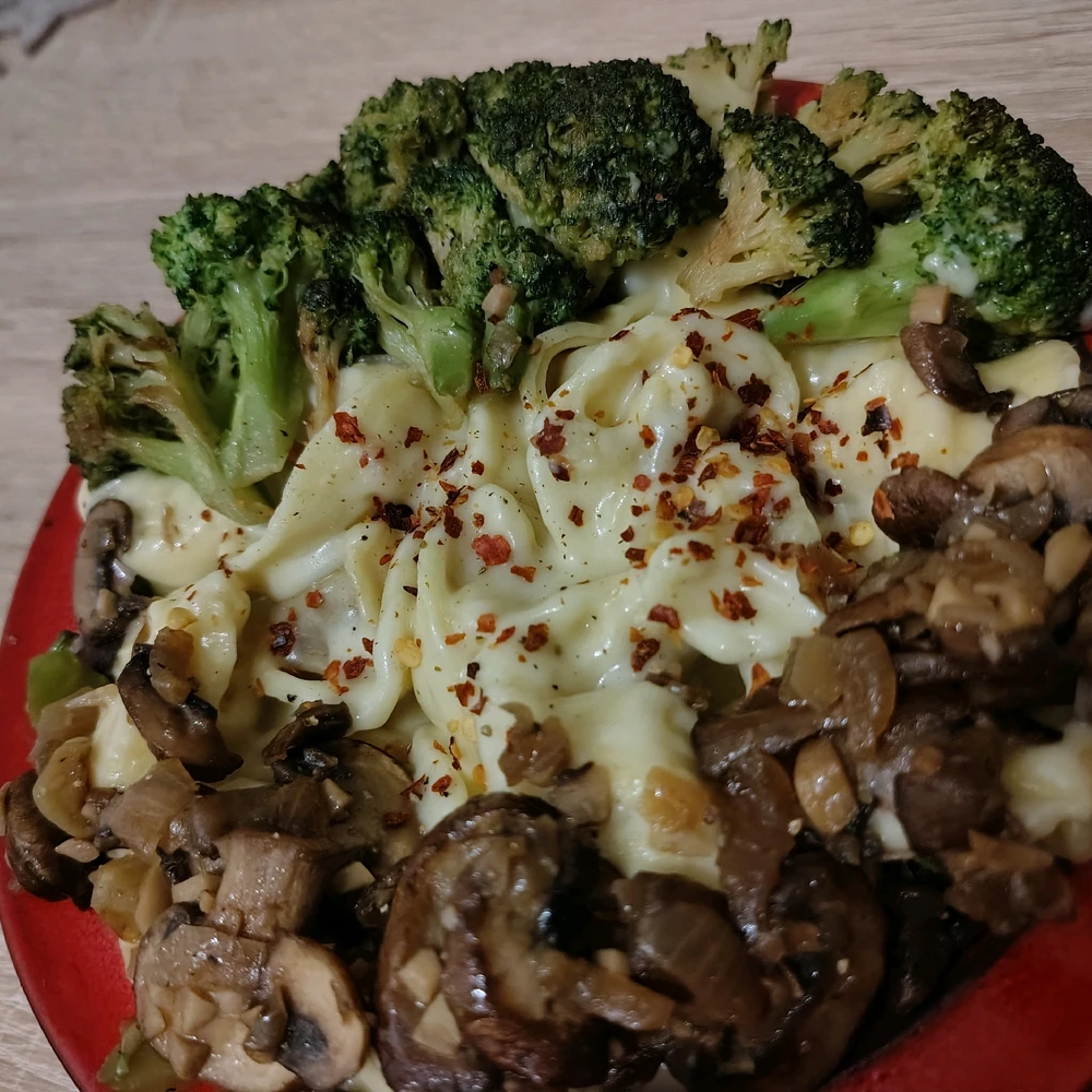 Tortellini drowned in cheese sauce