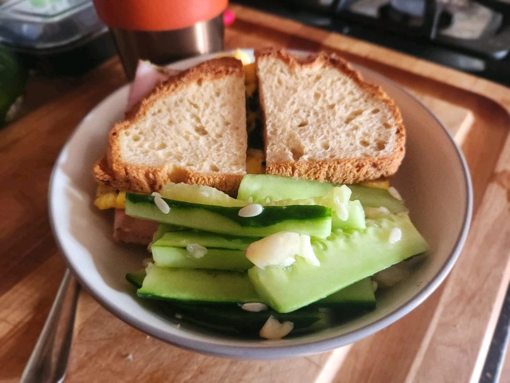 Ham and egg sammich with sliced garlic cucumber
