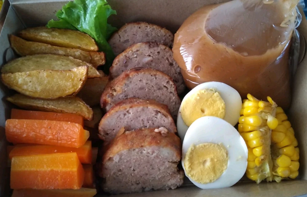 It's called Galantine serve with vegetables and potato wedges and sweet sauce...
