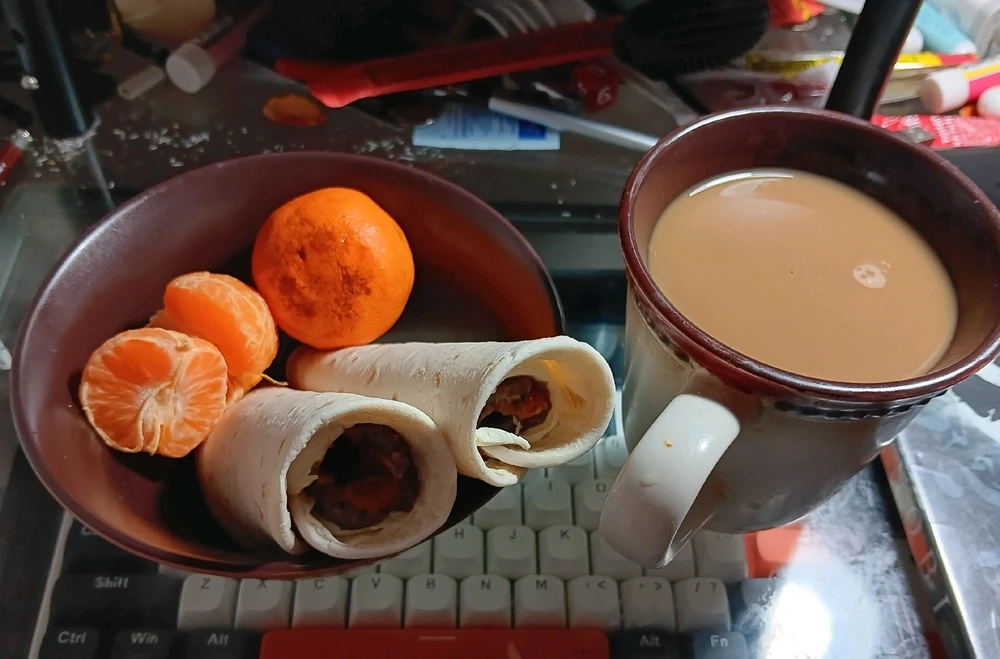 This mornings breakfast: black bean/cream cheese/ & hot pepper sauce tortilla roll ups/ clementine oranges/ coffee/milk/no sugar...
...