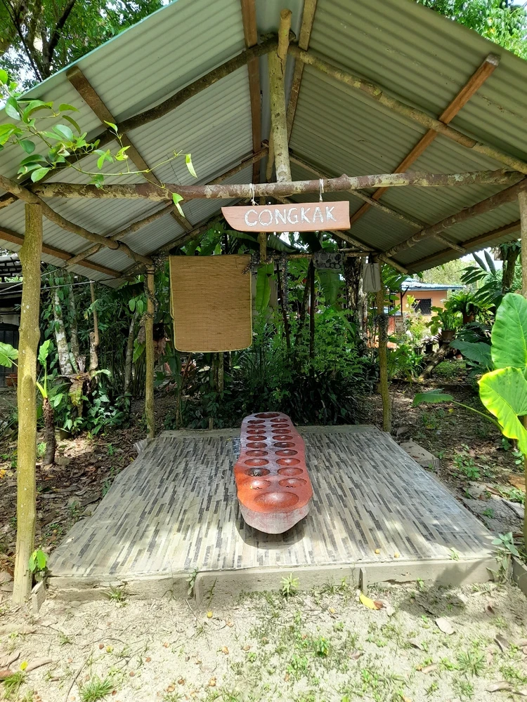 Mancala but here we call it 'congkak'. This one is massive and made from solid hard timber.