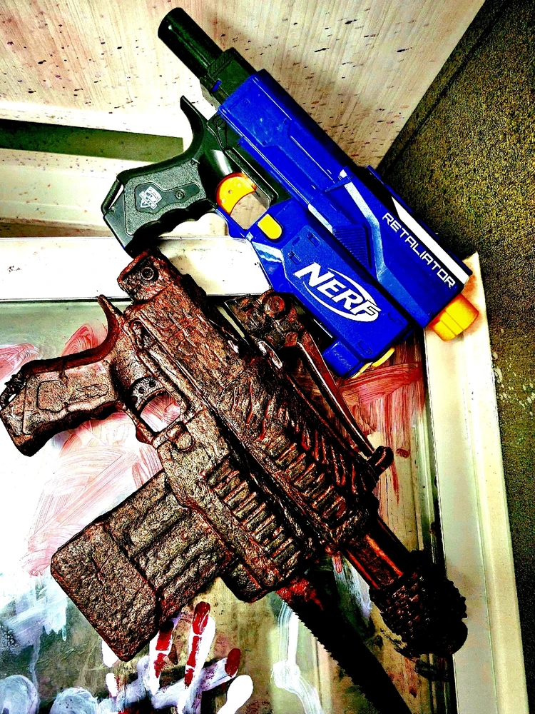 Same model Nerf guns. Top is unmodified.