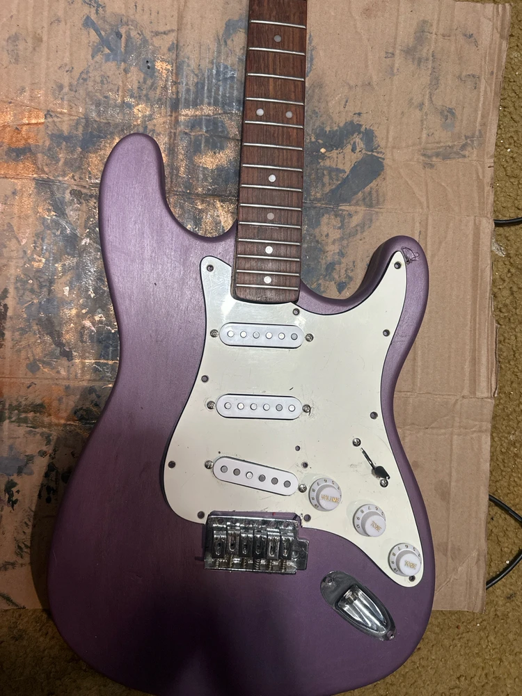 Dried, with the seal and pickguard. Liked it but I wanted to go with black hardware.
