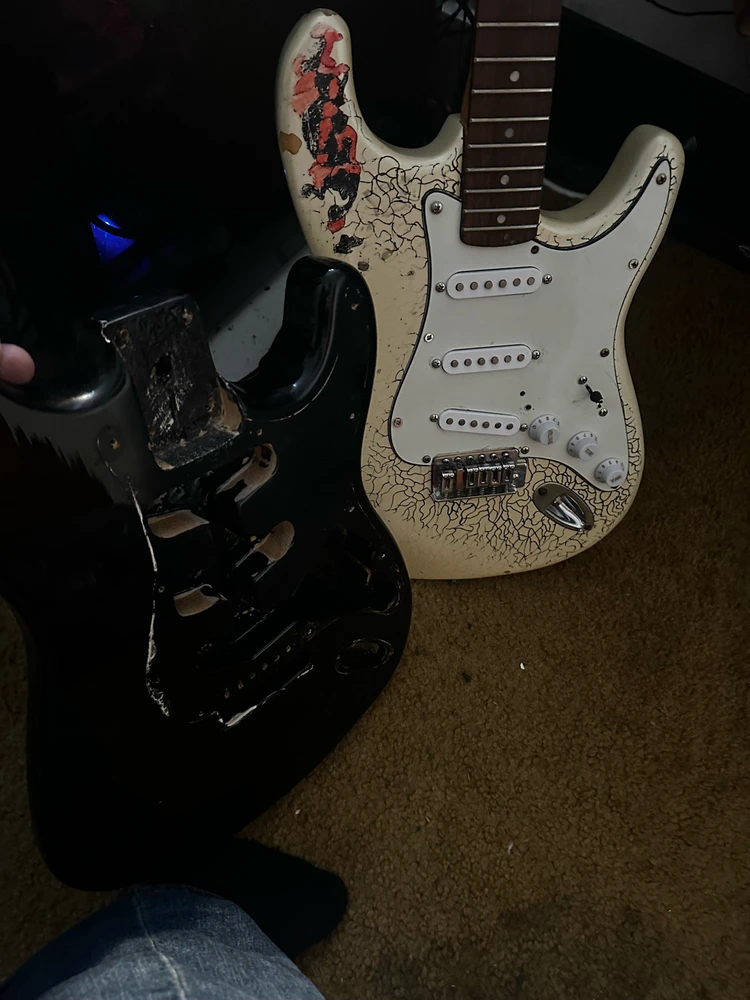 A Squier’s body and the sacrificial Lotus.