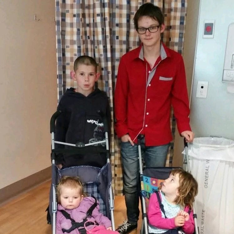 Two sisters and a brother are visiting during the recovery from heart surgery.