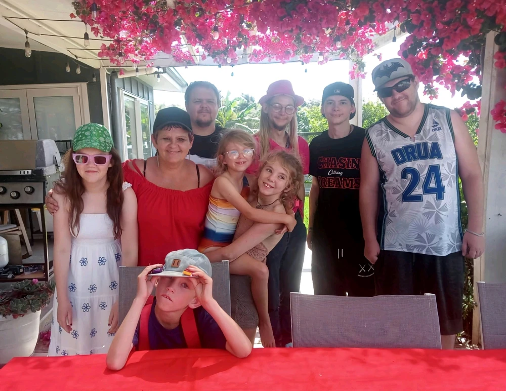 Group ohoto of me and sone of my siblings + step mum