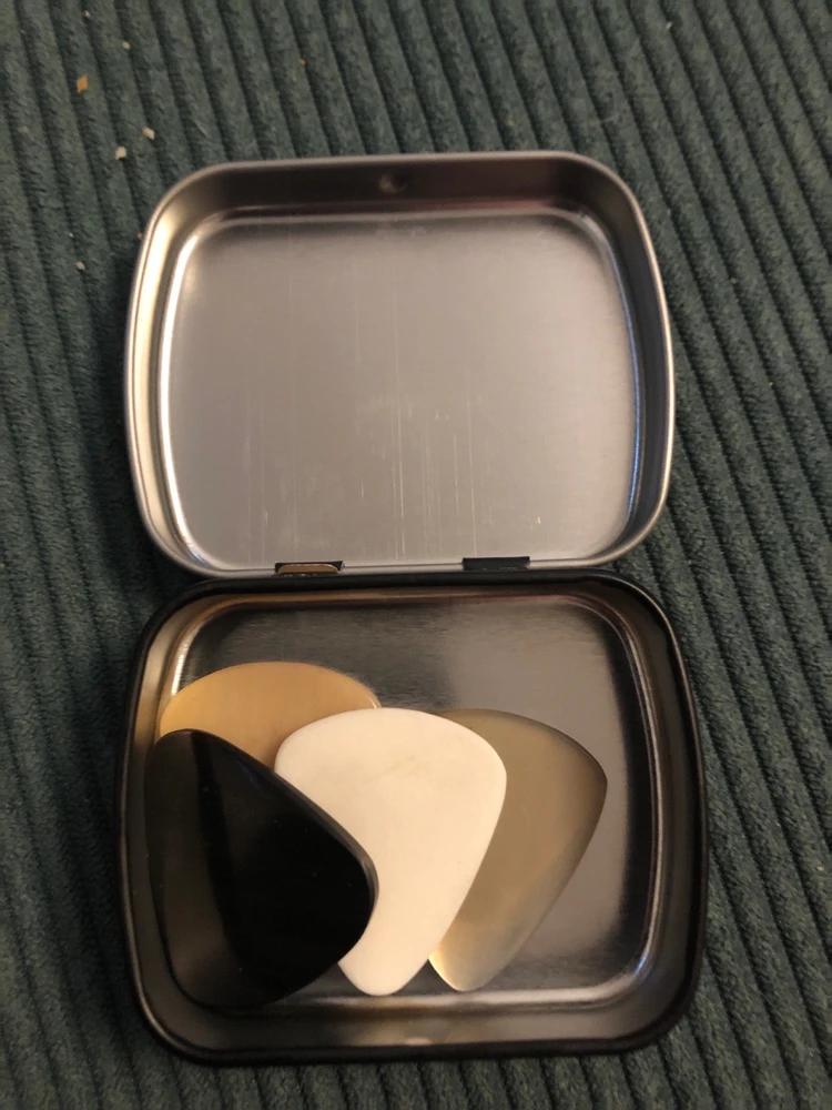 A tin or guitar picks