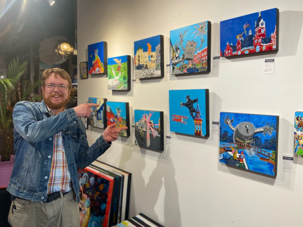 Me standing infront of my last art show where I was โfeature artistโ Art warriors save Stratford