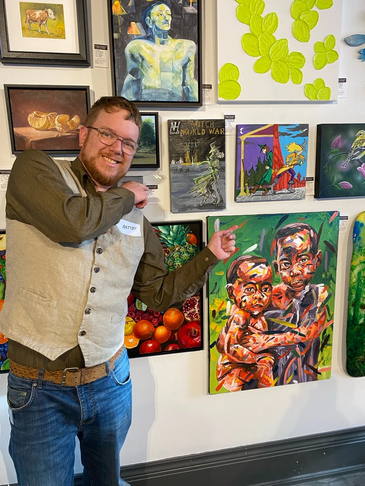 Here I am at the same gallery 1 year prior where my graphic novel paintings โwitch world warโ were being displayed.