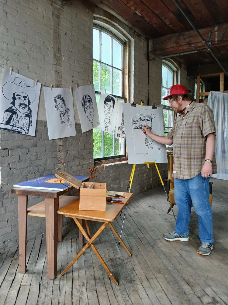 Here I am working on some of my caricature for my display for the upcoming Stratford art market