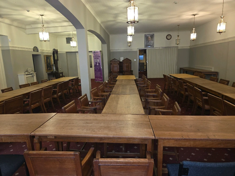 Room set up ready for a formal dinner of 75