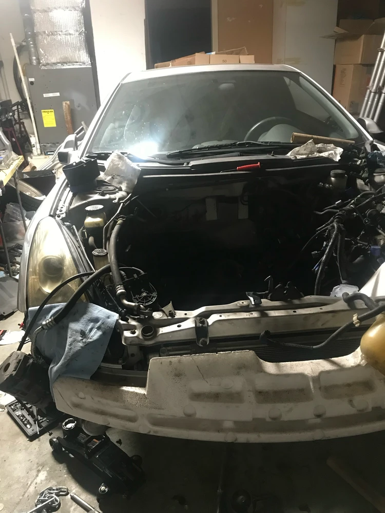 2001 Toyota celica with an empty engineer compartment where an engine should be…
