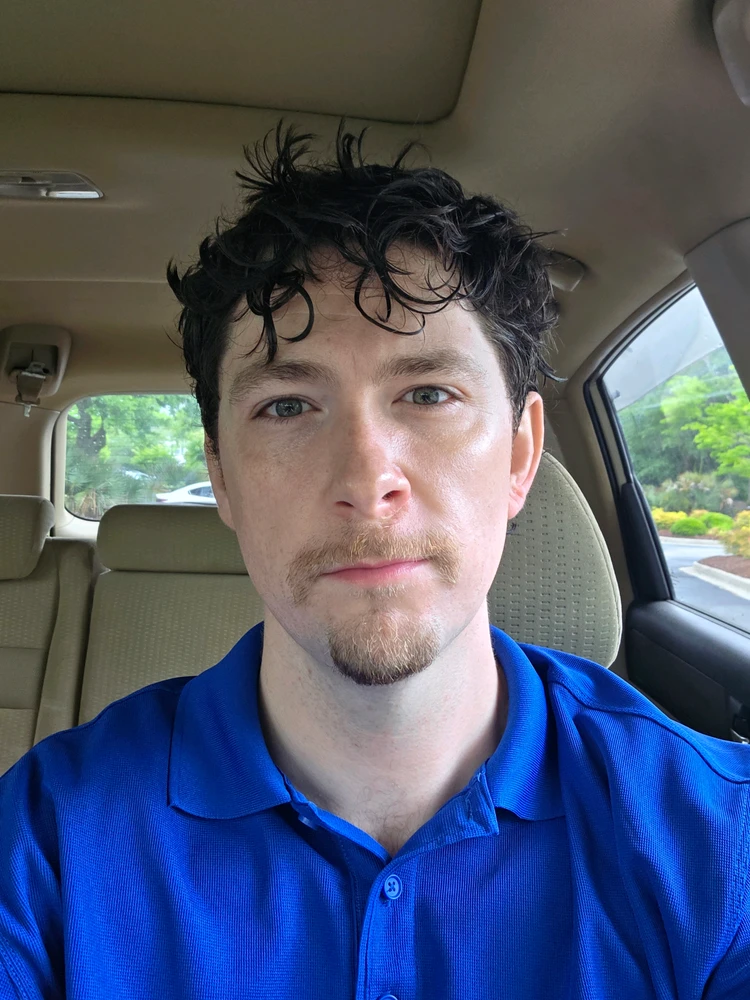 Wet hair selfie in car before work