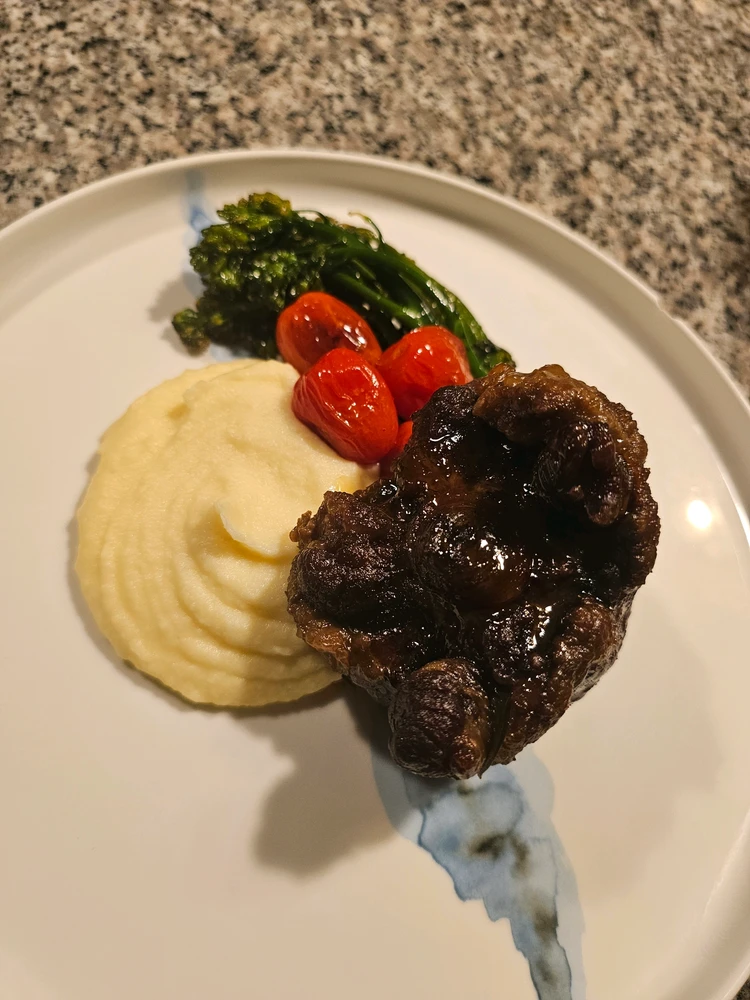 Braised Oxtail with Yukon & Parsnip Puree with Broccolini and Blistered Tomatoes