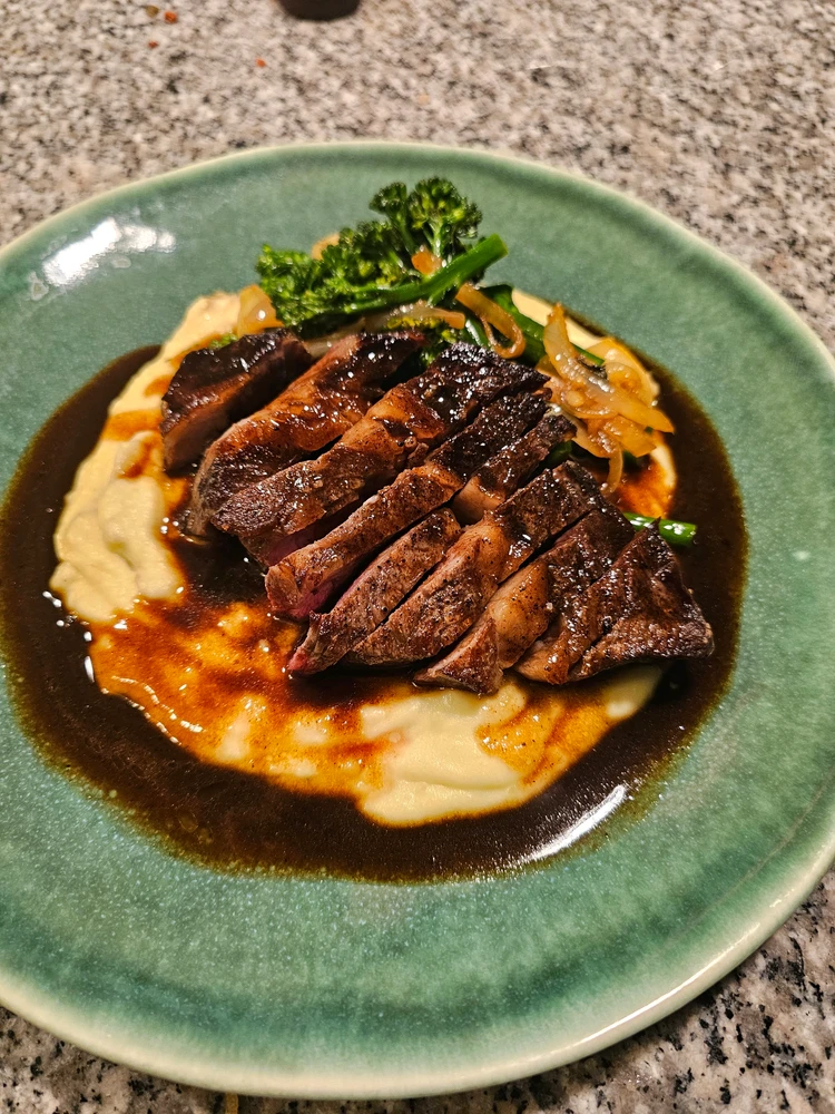 Beef Birria Sous Vide with Pomme Puree and Spring Vegetable Medley, topped with Demi Glace