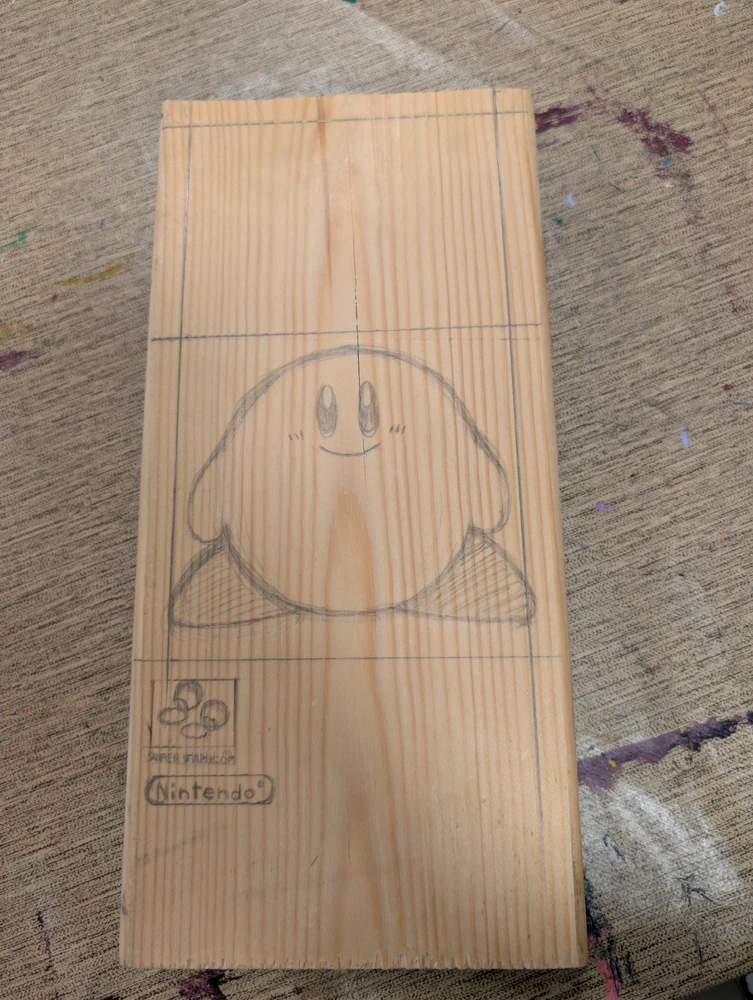 Kirby SuperStar's Japanese box art except it's drawn on real wood