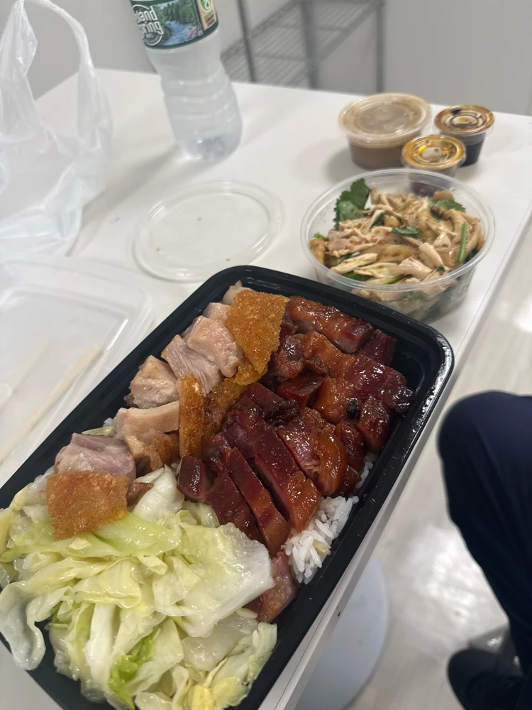 Crispy Pork and Char Siu over rice and cabbage. side of Hand-Pulled chicken. 