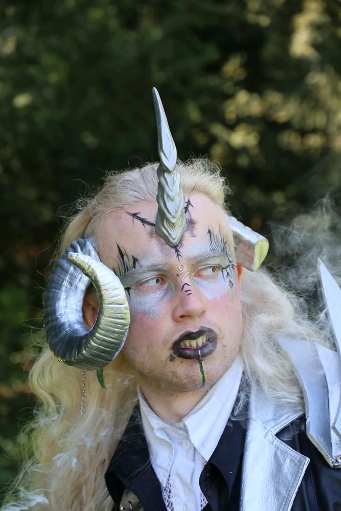 My vampire dragon dentist character close up. The face is clouded in smoke, the eyes are piercing.