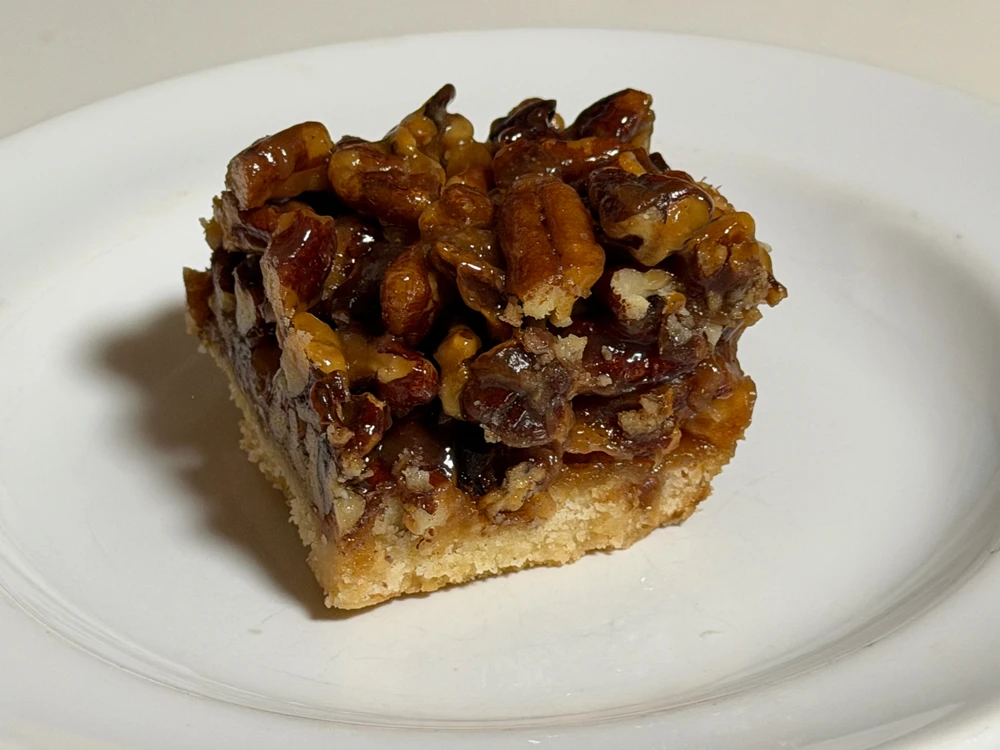 One piece of a pecan pie bar