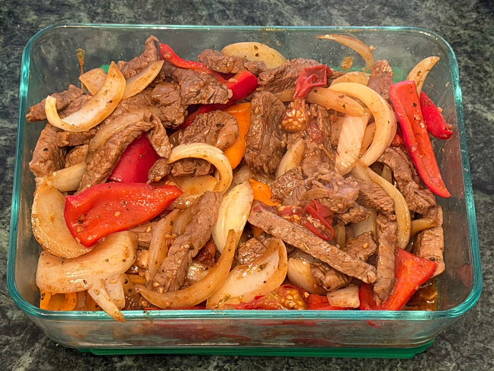  Steak fajitas in a rectangular Pyrex dish 