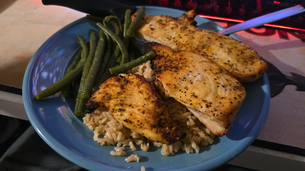 Air fried lemon pepper chicken with brown rice and green beans both cooked in a rice cooker