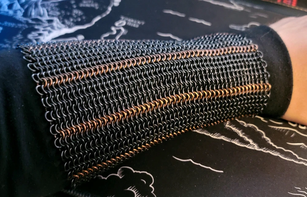 A simple pattern for the sleeves. I settled on this before anything else. It's blackened stainless steel and bronze.